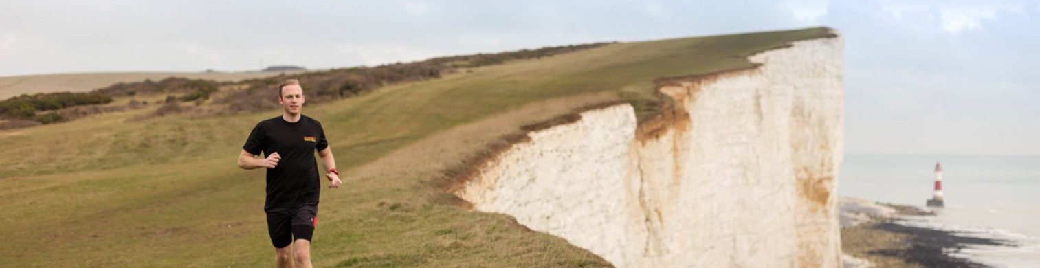 The cliff path above Beachy Head, the lighthouse in the sea below